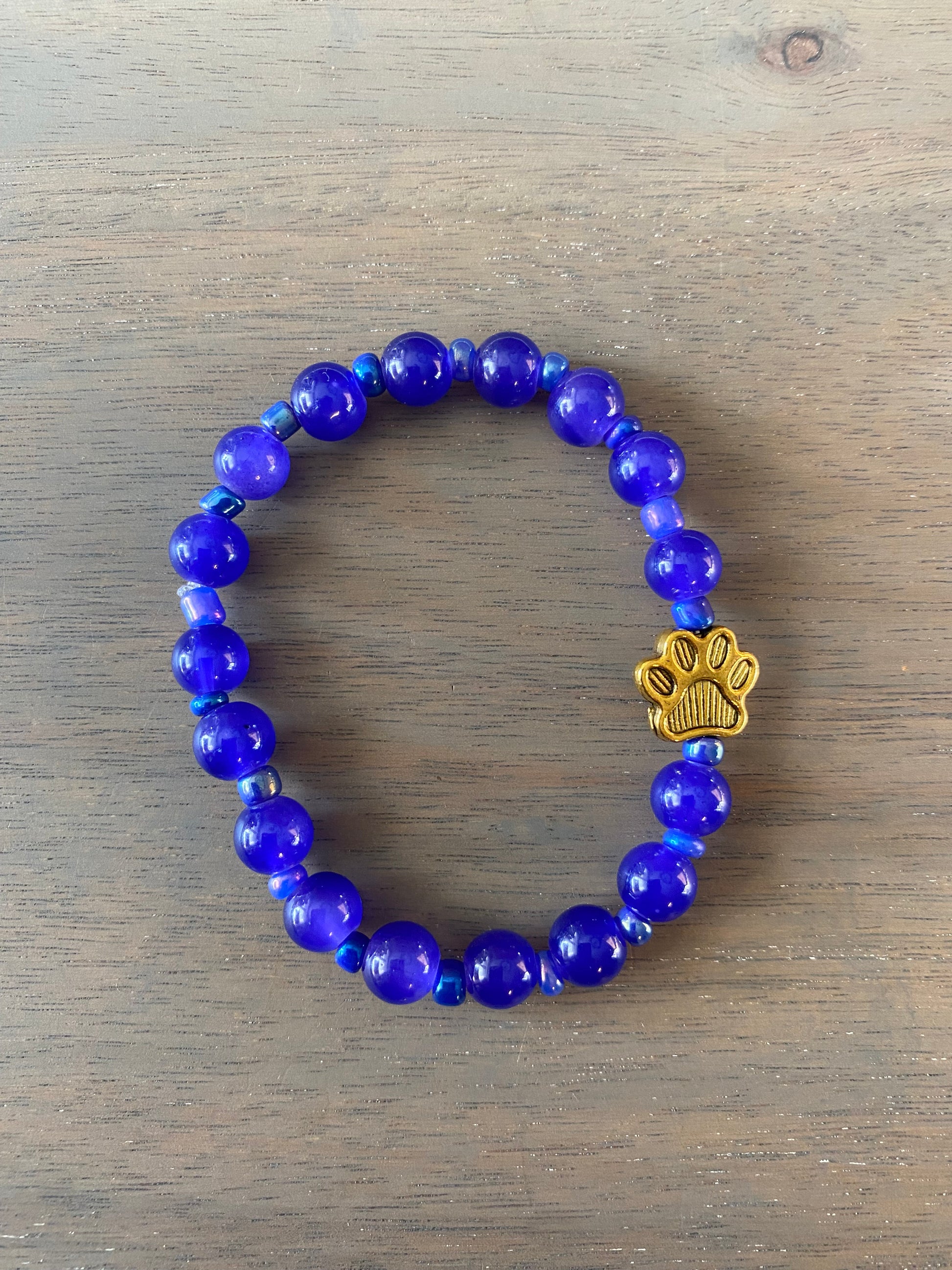 Stretch Cord Bead Bracelet with Gold Paw